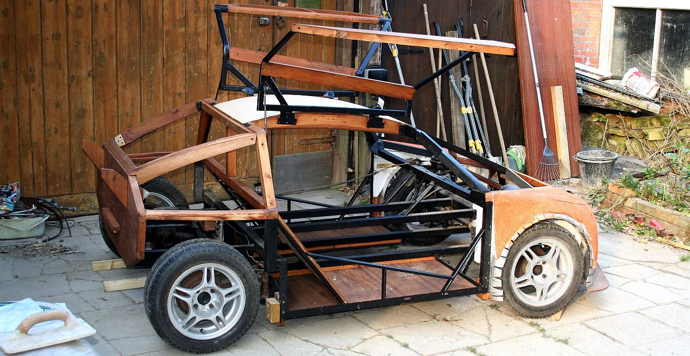 Electric car spaceframe with gull wing doors and hydrogen battery cartridge