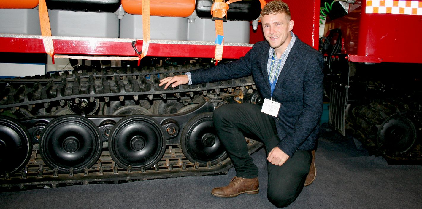 Andrew Statham admiring the caterpillar tracks of this amphibious vehicle