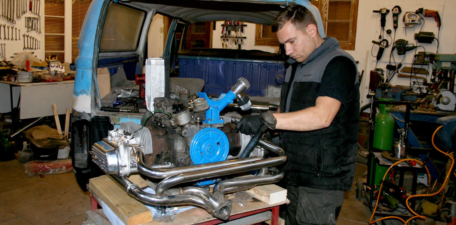 Our motor mechanic, Darren, carefully assembling the boxer engine