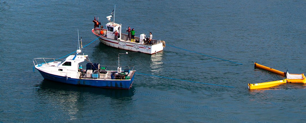 Fishing boats trawling for plastic